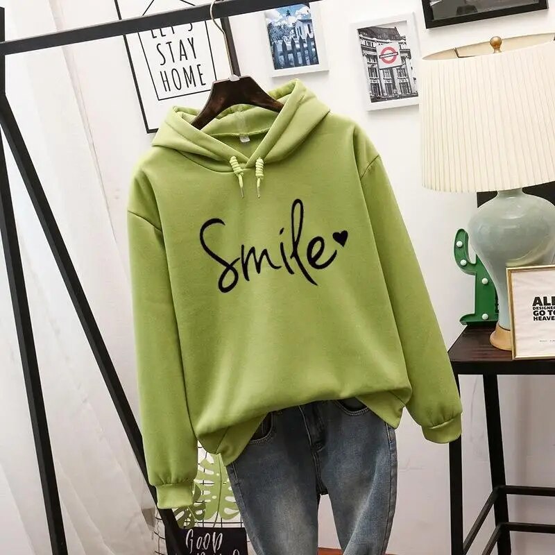 Women's graphic smile hoodie, a comfortable and cozy pullover for a happy, casual everyday look.