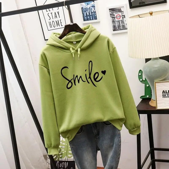 Women's graphic smile hoodie, a comfortable and cozy pullover for a happy, casual everyday look.
