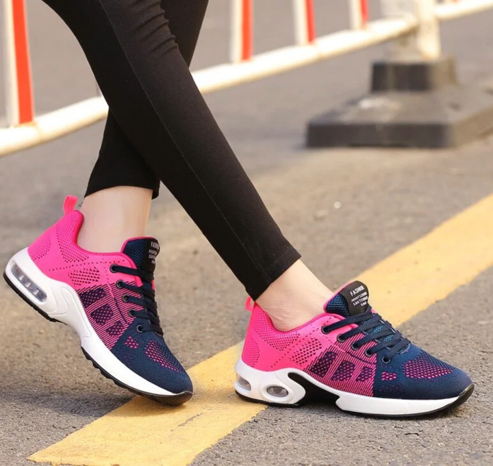 Stylish women's lace-up athletic sneakers with air-cushioned soles for supreme comfort & support.