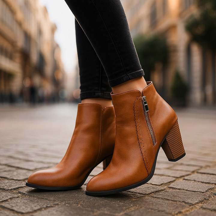 Women's comfortable ankle boots with convenient side zipper and elegant scalloped edge for everyday wear.
