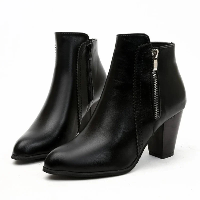 Comfortable women's ankle boots with a smooth zipper closure and pretty scalloped details, ideal for all-day wear.