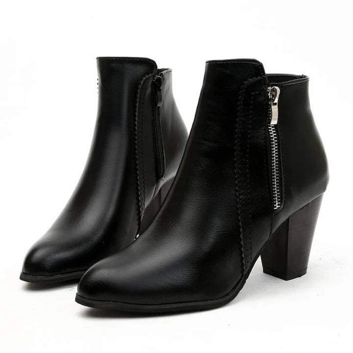 Comfortable women's ankle boots with a smooth zipper closure and pretty scalloped details, ideal for all-day wear.