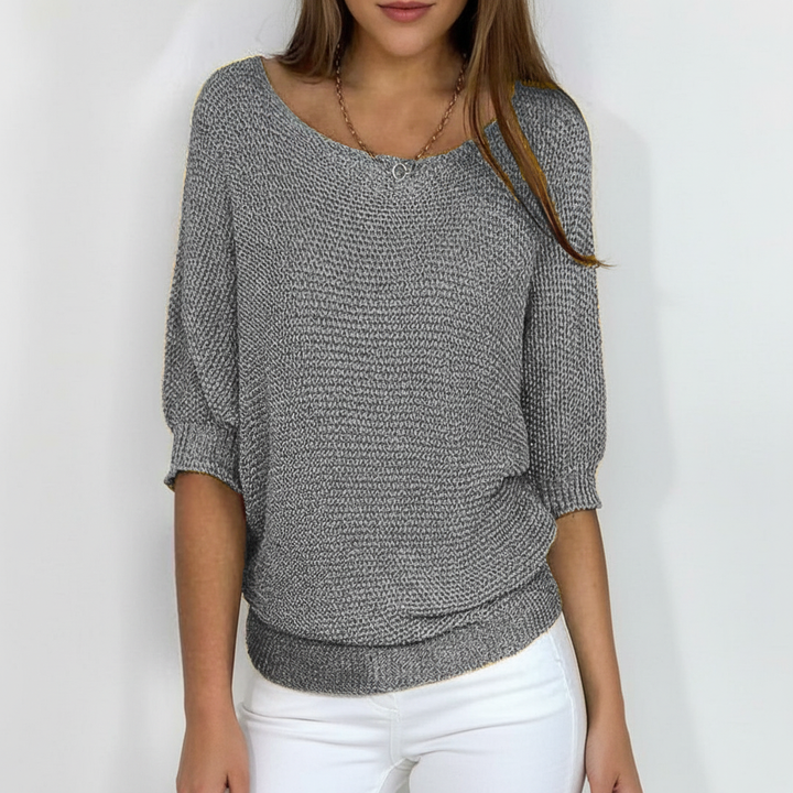 Stylish women's knitwear with batwing sleeves, perfect for a chic and casual autumn look.