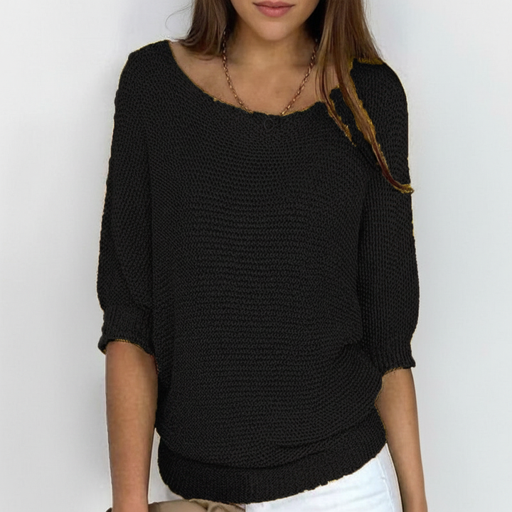 Loose fit women's knit sweater with batwing sleeves, great for comfortable everyday wear.