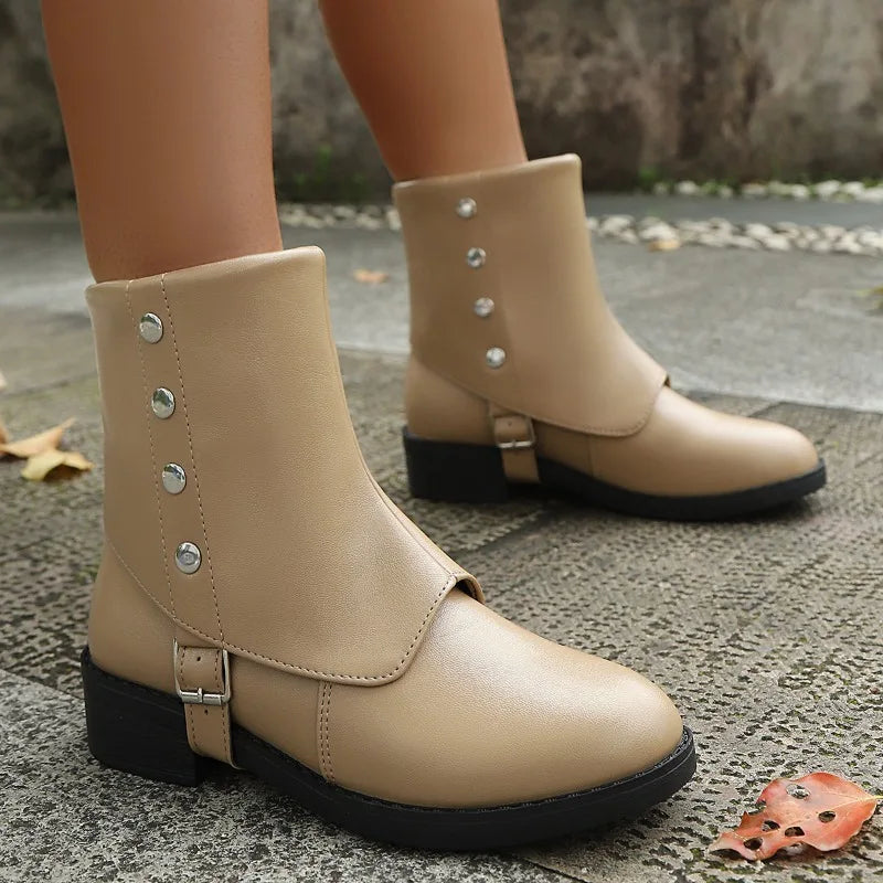 Women's everyday ankle boots in classic black, offering ultimate comfort & style for fall/winter outfits.