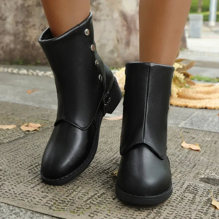 Chic brown women's ankle boots with a low heel, perfect for all-day comfortable wear & versatile styling.