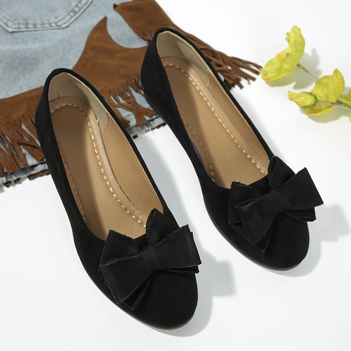 Comfortable gray women's slip-on wedge ballet flats with a classic bow & round toe.