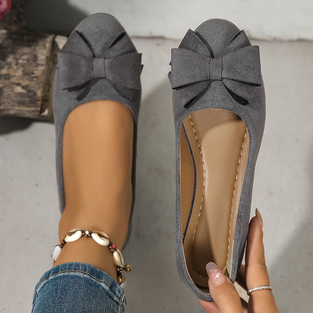 Stylish blue women's wedge ballet flats, slip-on design, featuring a charming bow.