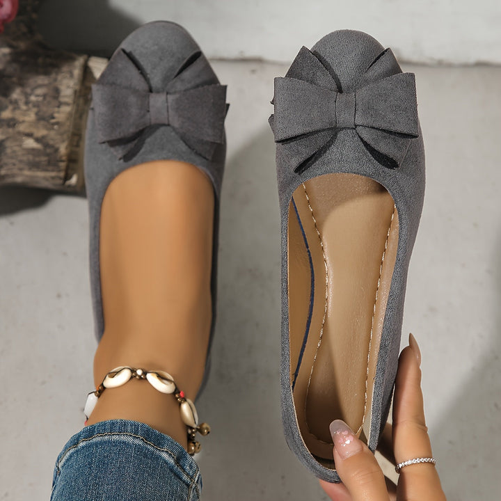 Stylish blue women's wedge ballet flats, slip-on design, featuring a charming bow.