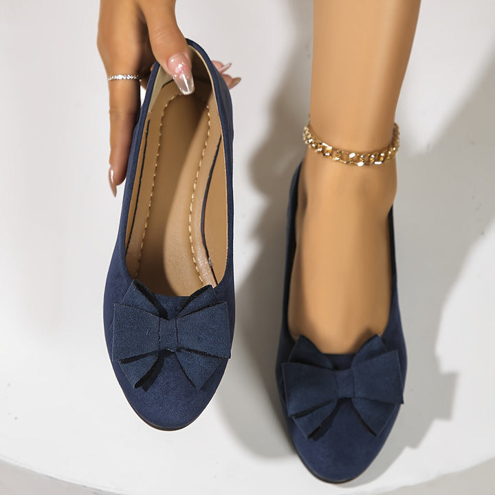 Versatile blue women's wedge ballet flats with a sweet bow and comfortable slip-on style.
