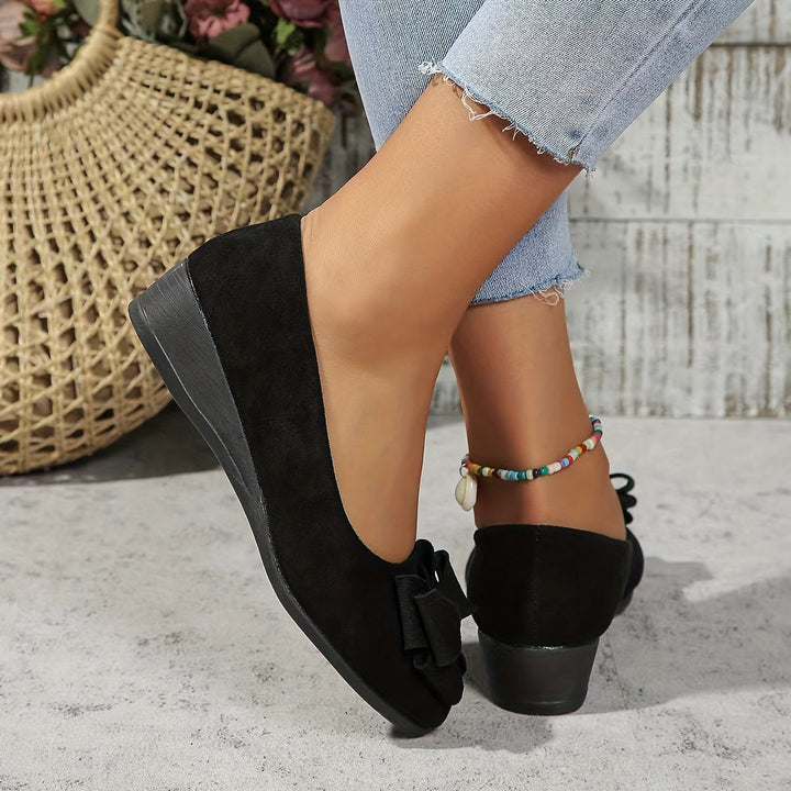 Chic brown women's casual slip-on wedge flats featuring a classic bow & round toe design.