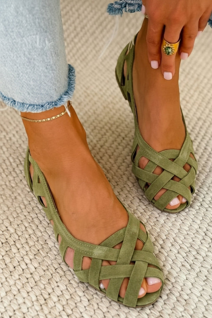 Comfortable slip-on women's sandals with braided crossover straps, essential summer casual flats.
