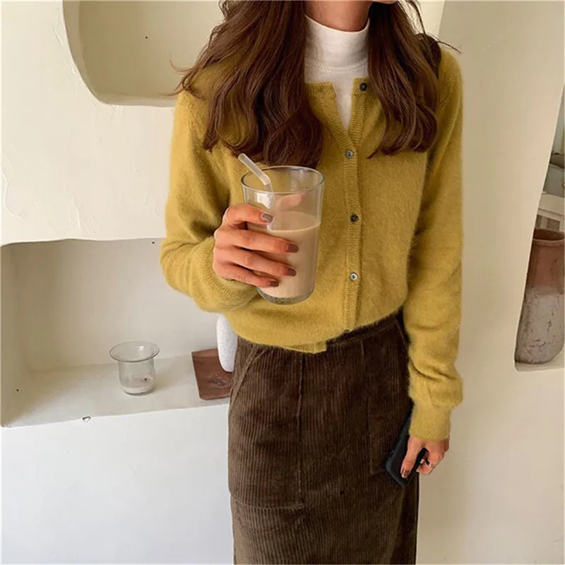 Warm & comfortable women's knitted button-front cardigan, essential for cool season layering.