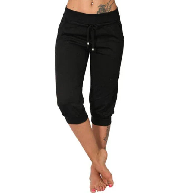 Women's casual capri trousers with functional drawstring waist and pockets, great for activewear.