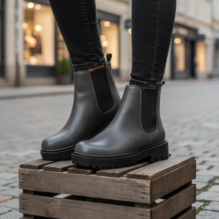 Women's comfortable Chelsea ankle boots in black, side view, perfect for autumn fashion