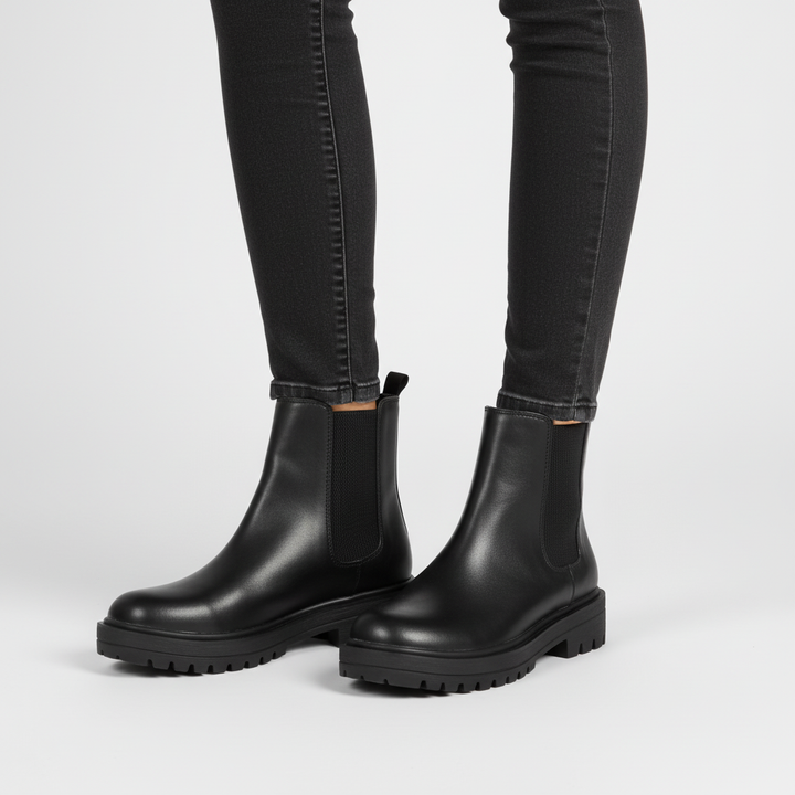 Comfortable women's black Chelsea boots, model wearing for a casual, elegant look