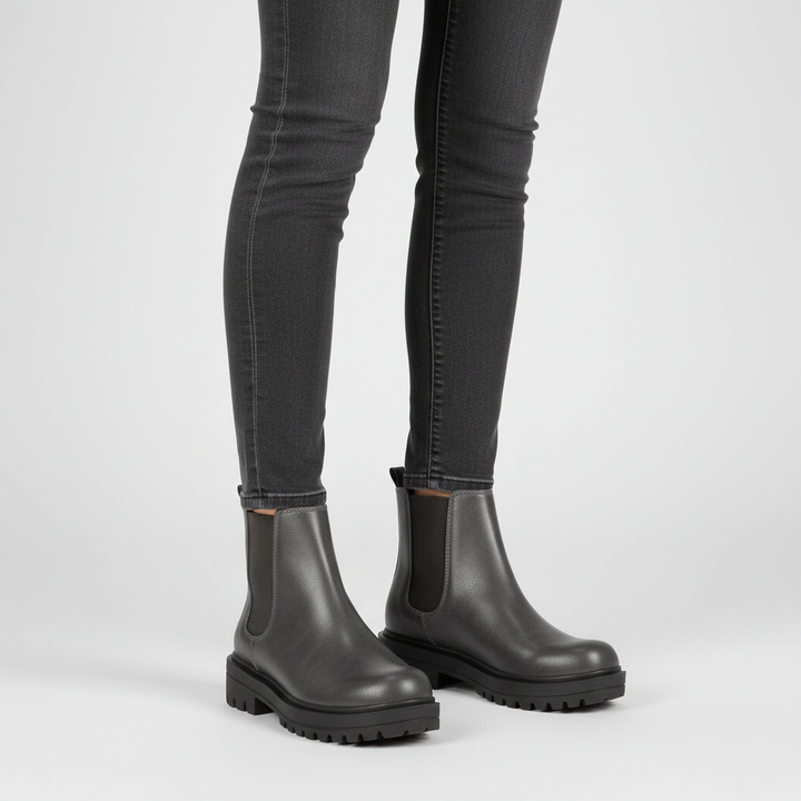 Stylish women's Chelsea ankle boots, close-up of elastic side panel, versatile everyday footwear