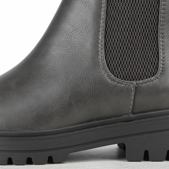 Pair of comfortable black Chelsea boots for women, front view, ideal for winter outfits
