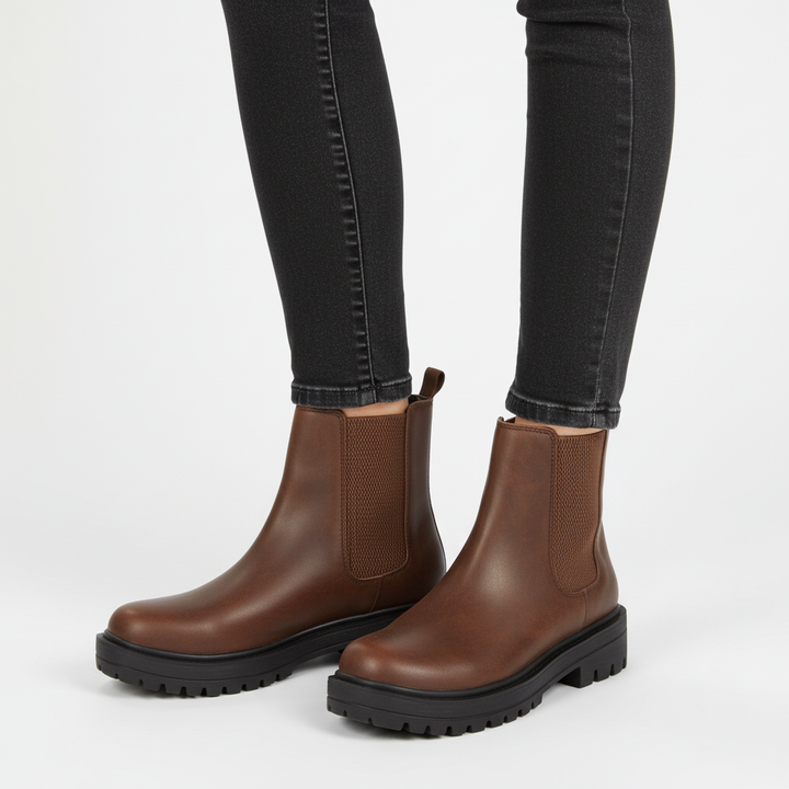 Close-up of sole on women's comfortable Chelsea ankle boots, durable everyday boot