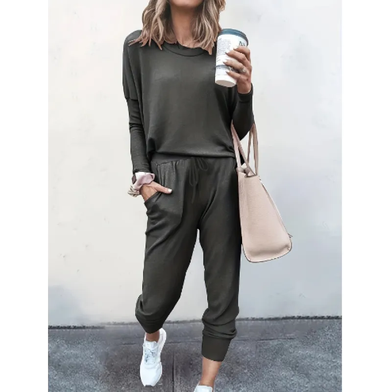 Women's comfortable crew neck jogger set in a stylish solid color, perfect for lounging or casual wear.