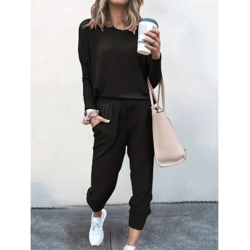 Stylish women's loungewear set featuring a long sleeve crew neck top and comfortable tapered jogger pants.