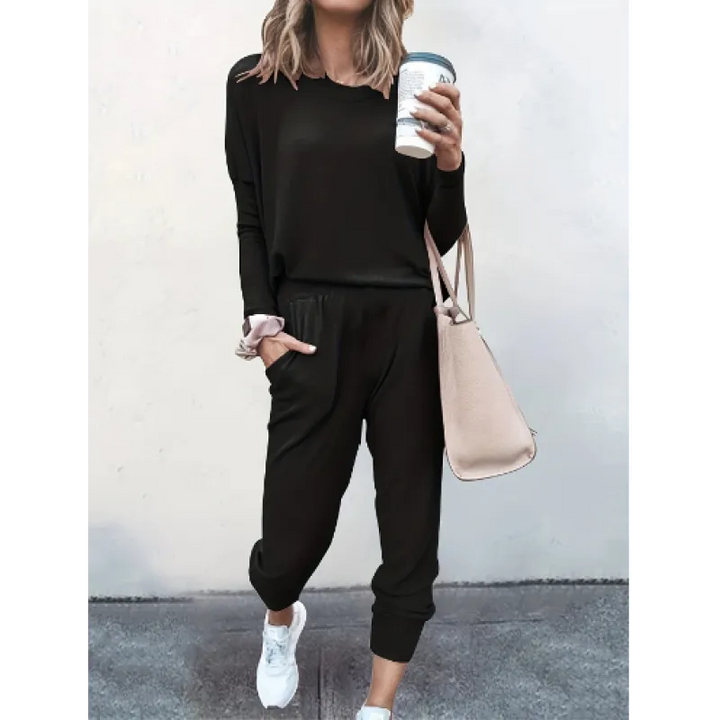 Stylish women's loungewear set featuring a long sleeve crew neck top and comfortable tapered jogger pants.