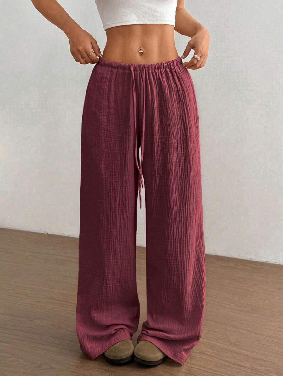 Stylish crinkle texture wide leg pants with drawstring, ideal for casual bohemian summer outfits.