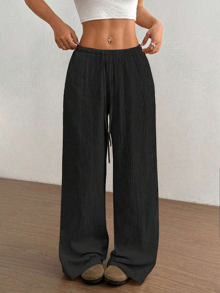 Bohemian style crinkle wide leg pants for women, perfect for relaxed casual summer fashion.