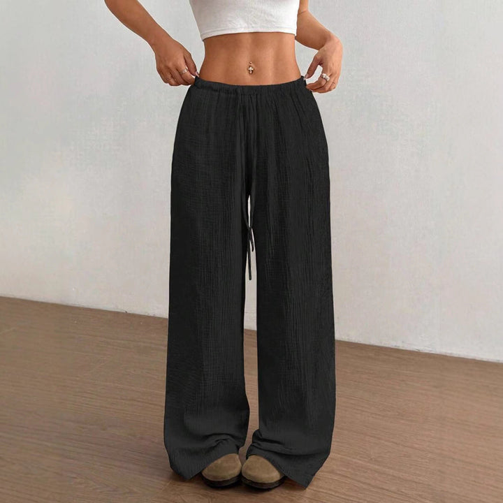 Women's wide leg pants featuring a crinkle texture and adjustable drawstring waist for comfort.