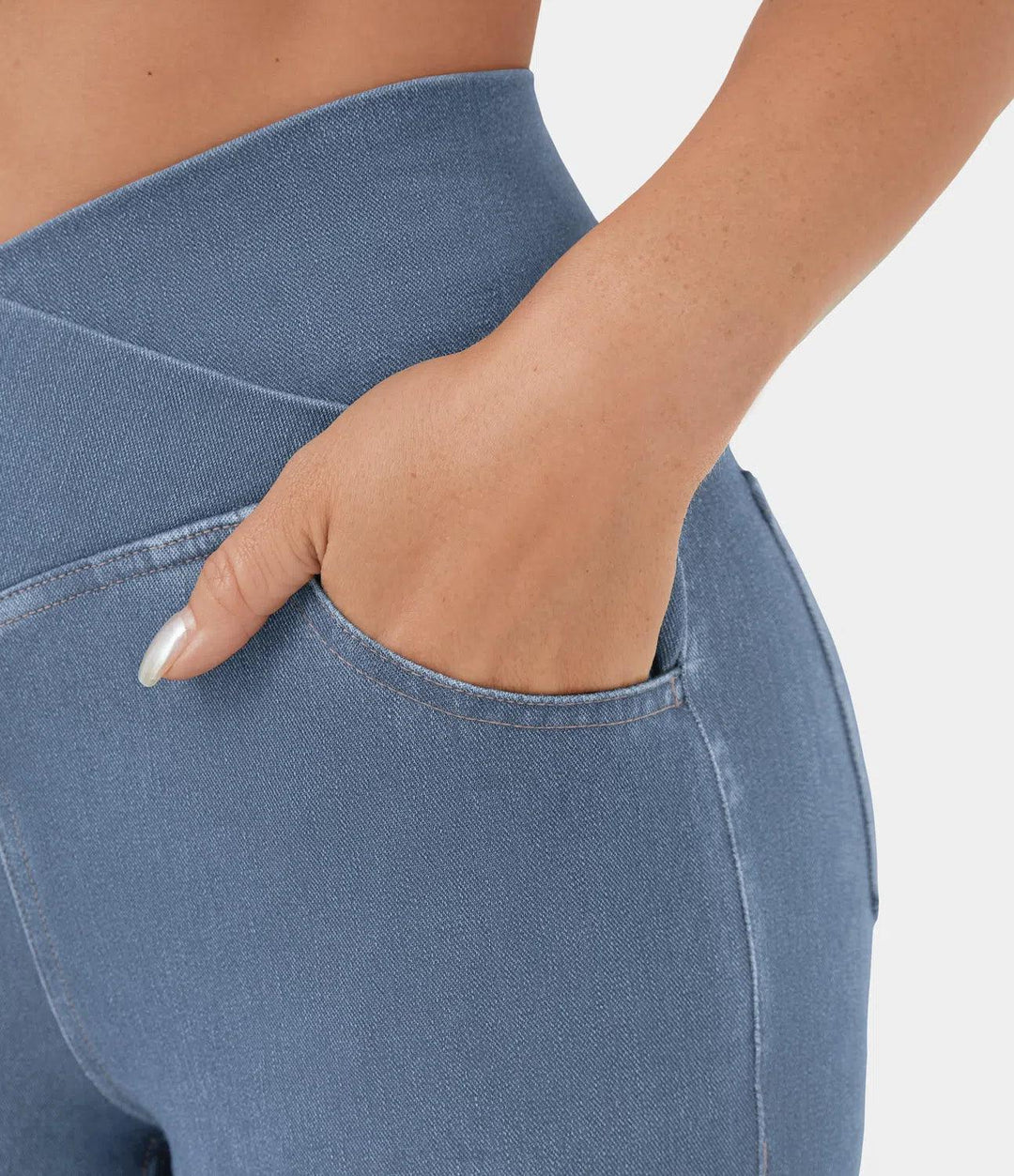 Light blue curvy fit high waist stretch jeans for women, comfortable casual fashion.