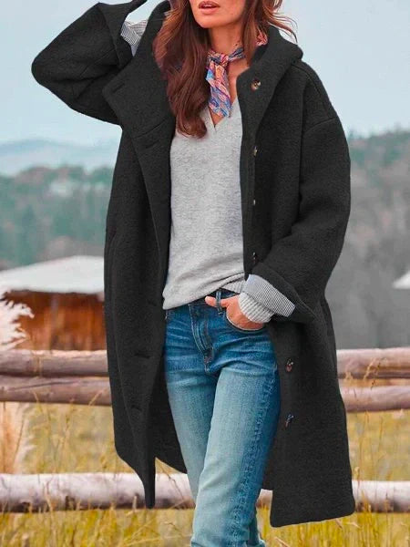 Stylish women's everyday coat, relaxed fit. Features long sleeves, button closure, and practical pockets for comfort.