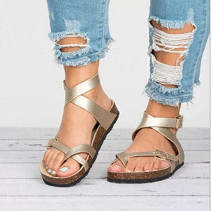 Women's comfortable flat strappy sandals for walking. Features traction sole and adjustable buckle for everyday wear.