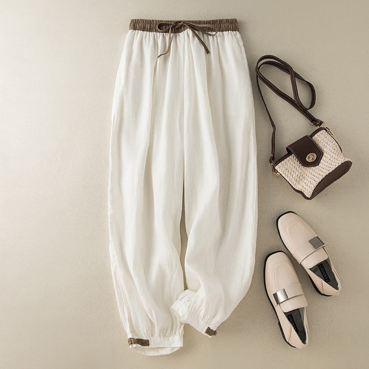 White women's casual harem pants, super comfortable with a relaxed fit perfect for summer outings.