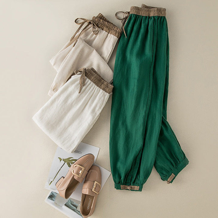 Stylish women's comfortable tapered harem pants with an adjustable hem for a personalized casual look.