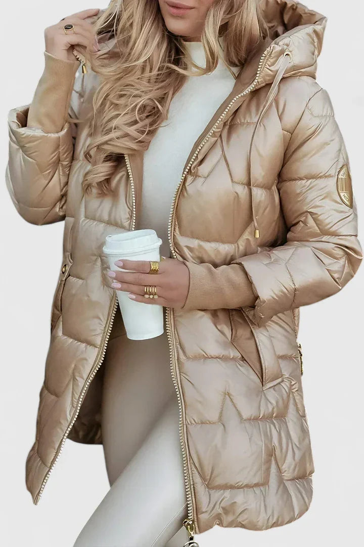 Women's comfortable hooded autumn winter coat, padded for warmth. Elegant and versatile outerwear.