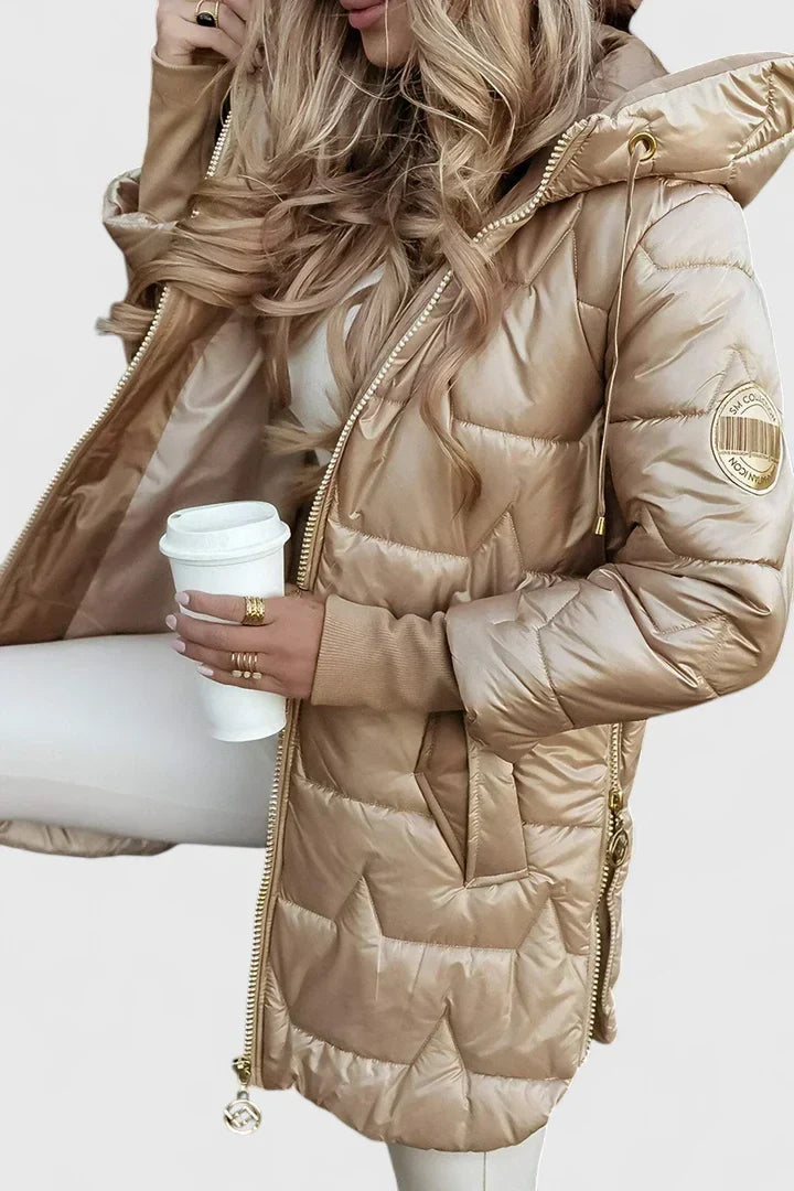 Warm women's autumn winter jacket with a hood. Padded for comfort, stylish and elegant outerwear.