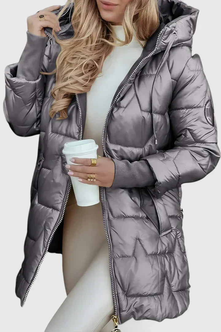 Stylish women's comfortable hooded coat. Warm padded outerwear, perfect for autumn & winter fashion.