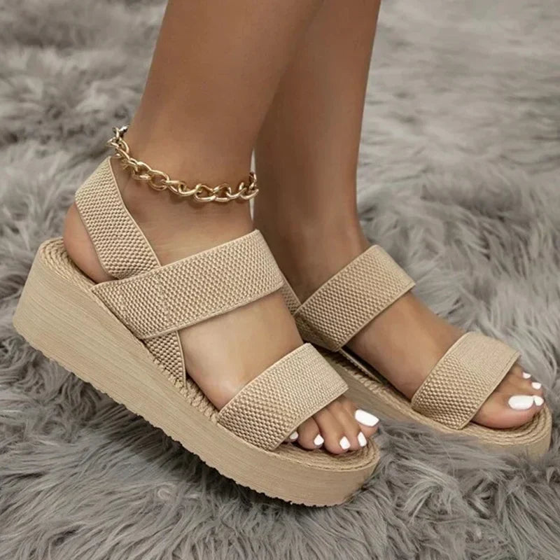 Stylish women's vacation sandals. Comfortable flat design perfect for warm weather & beach trips.