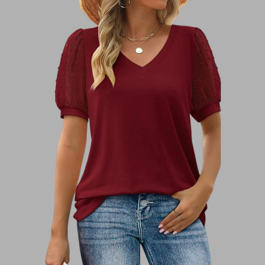 Close-up of soft top fabric, highlighting comfortable texture & quality of women's long sleeve blouse for daily wear.