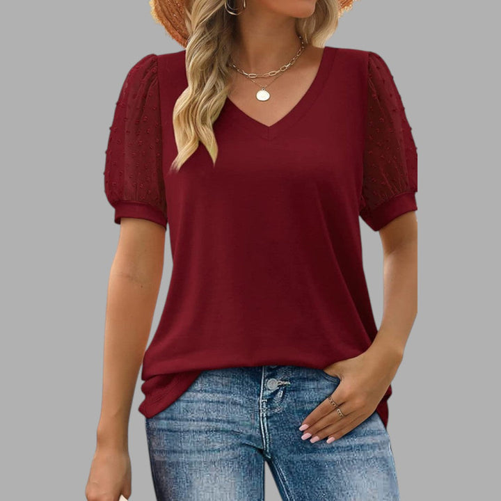 Close-up of soft top fabric, highlighting comfortable texture & quality of women's long sleeve blouse for daily wear.