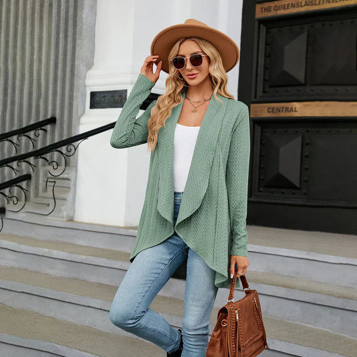Close-up of a women's open front knitted cardigan, highlighting its soft texture
