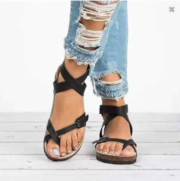 Close-up of women's orthopedic sandals with arch support & adjustable straps for casual wear.