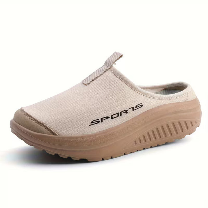 Women's comfortable orthopedic slip-on slippers for everyday wear & foot support.