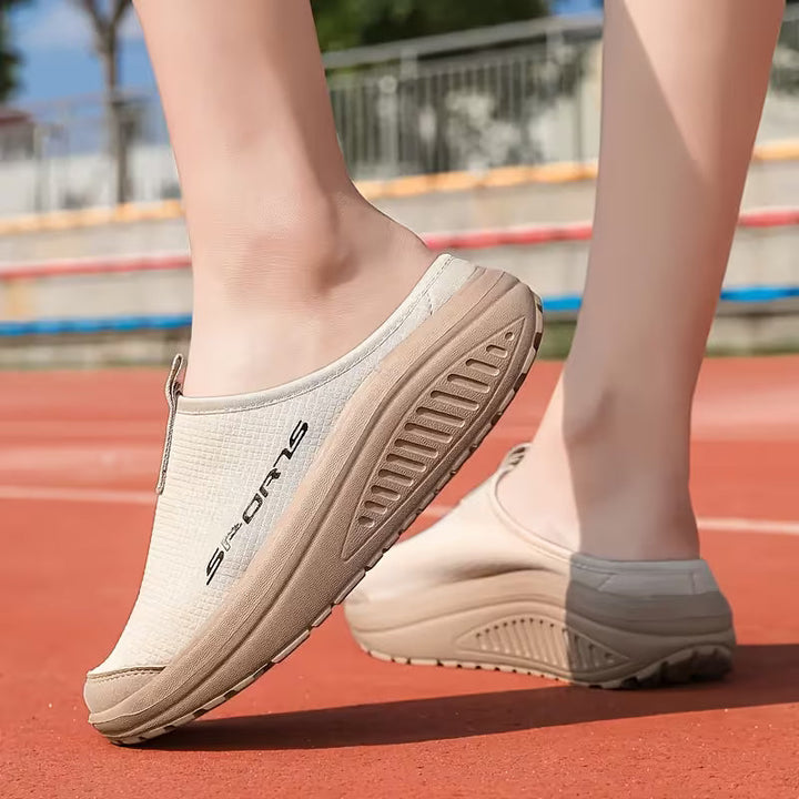 Durable women's orthopedic slip-on slippers with cushioned foot support.