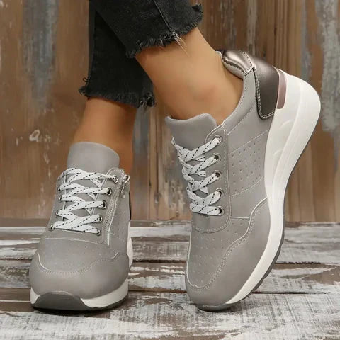 Side view of women's orthopedic walking shoes, showcasing arch support and ergonomic design
