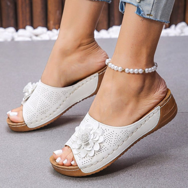 Handstitched women's casual wedge sandals, offering comfortable arch support for summer and everyday fashion.