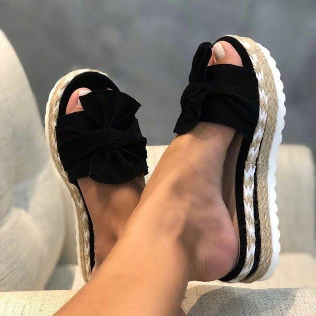 Close-up of women's platform sandals showing ergonomic arch support for comfortable orthopedic footwear.