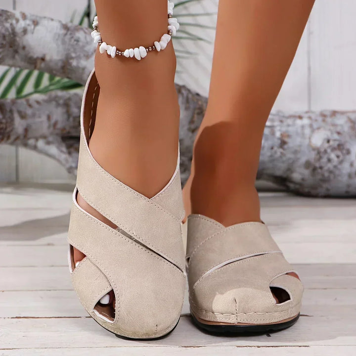 Stylish women's platform wedge sandals in a neutral tone. Ideal for casual summer outings and elevated fashion.