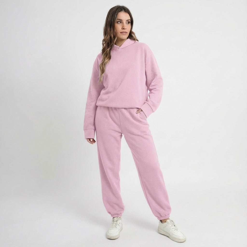 Stylish women's athletic tracksuit set in a vibrant color, offering comfort for all-season activewear