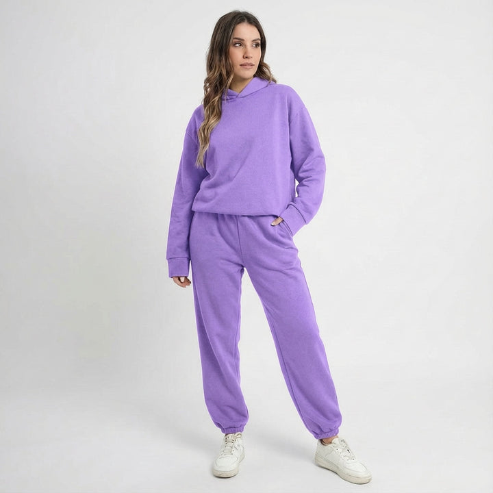 Women's polyester athletic tracksuit set in a neutral tone, providing all-season comfort and activewear versatility
